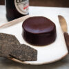 Aged Classic vegan cheese by Mouse's Favourite whole waxed wheel with charcoal crackers