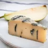 True blue vegan cheese by Mouse's Favourite single segment with pear behind