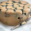 True blue vegan cheese by Mouse's Favourite extra large tall wheel for a special occasion with testing segment sample in front