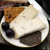 Special occasion vegan cheese by Mouse's Favourite - cut slice from large wheel Camblue.