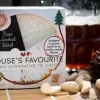 Beer washed rind vegan cheese by Mouse's Favourite cut segment showing front of packaging with beer glass in background.