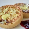 Vegan Gold butter alternative by mouses favourite melting into a hot crumpet with strawberry jam